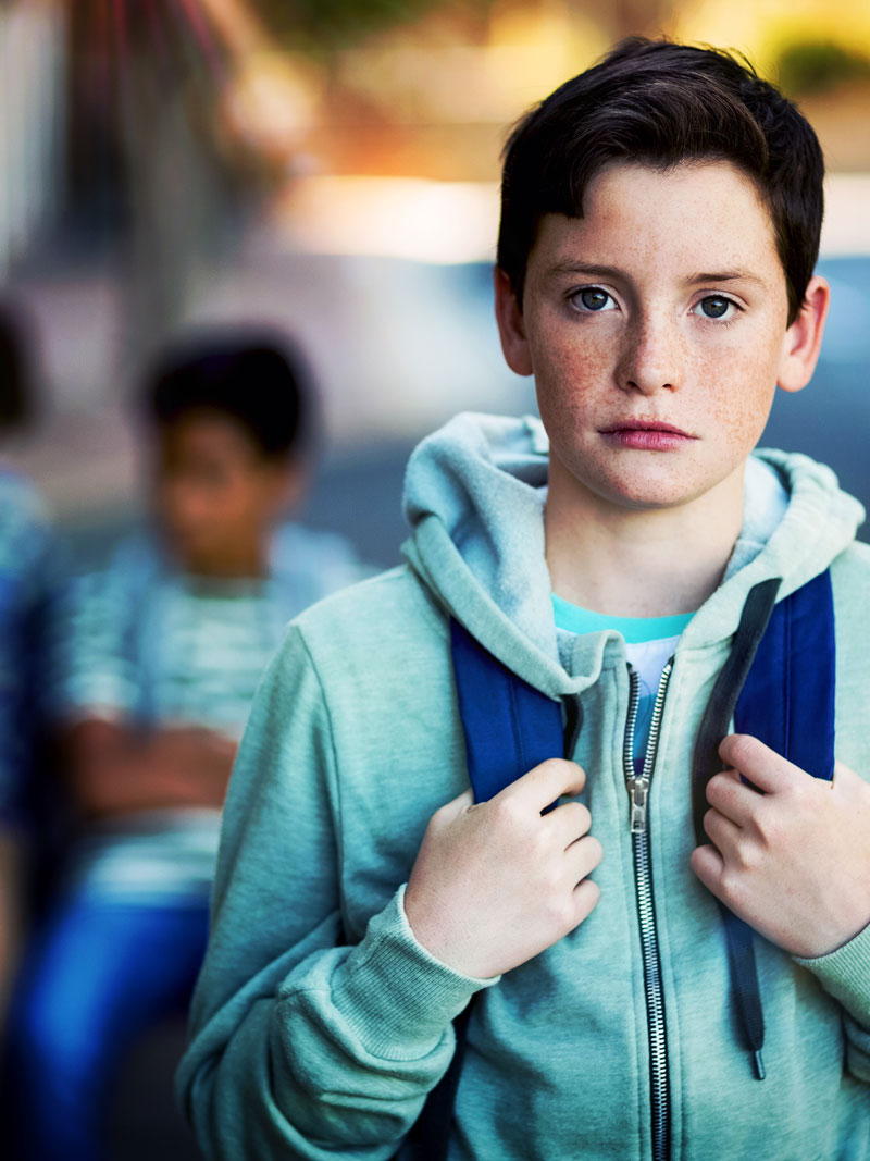 middle-schooler middle school boy student standing looking anxious for back to school day